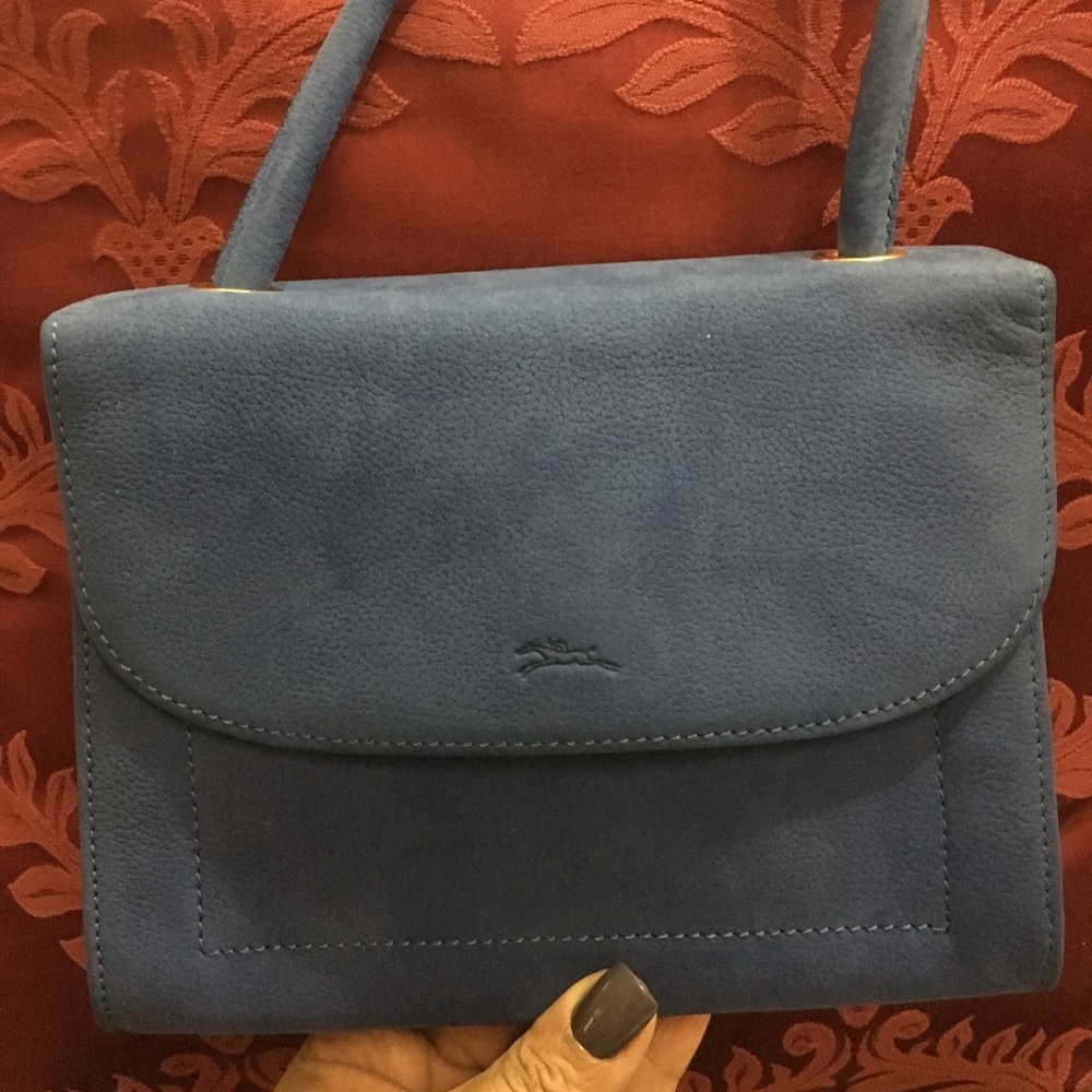 Blue suede Longchamps purse.